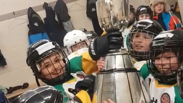 Kids celebrate with Grey Cup