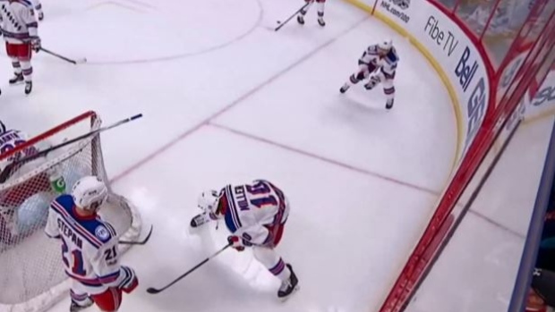 The Rangers engages in some 'puck-football' during warmups