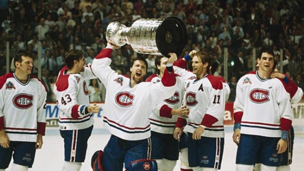 Patrick Roy hoists his first Stanley Cup in 1993 with the Montreal Canadiens.