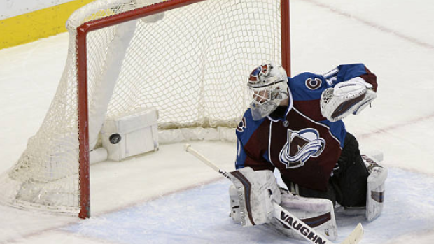 Calvin Pickard looks behind him to find the puck in the net against the New York Islanders.