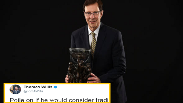 David Poile poses after he wins the General Manager of the Year award.