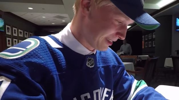 Fifth overall pick Elias Pettersson gets emotional as he watches his family celebrate the draft.