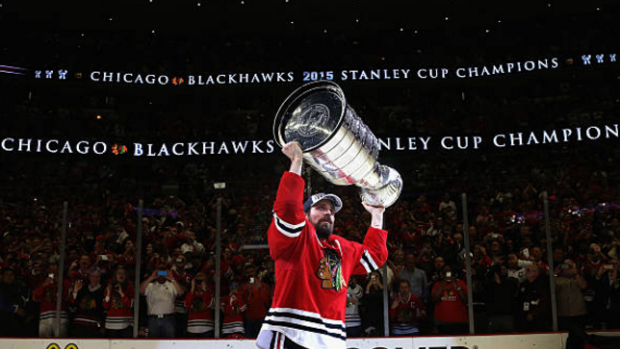 Patrick Sharp hoists the Stanley Cup