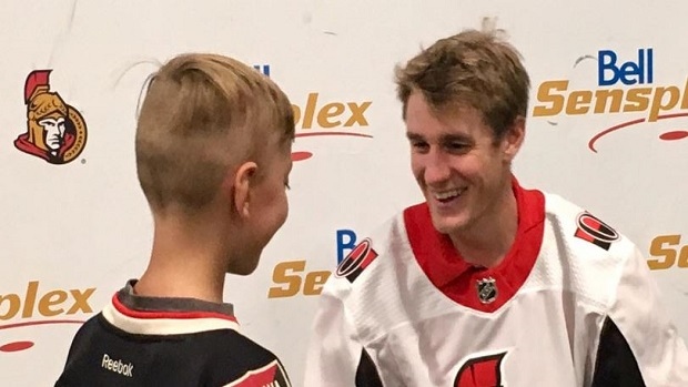 Kyle Turris with young Senators fan