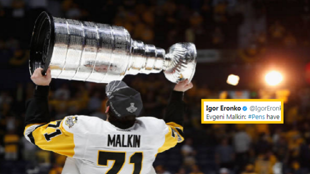 Evgeni Malkin hoists the Stanley Cup.