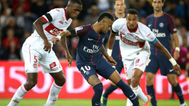 Neymar dangles through Toulouse FC opponents.
