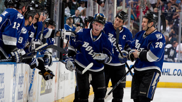 Steven Stamkos celebrates with teammates after recording his 50th goal during the 2009-10 season.