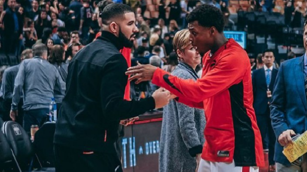 Drake and Raptors PG Kyle Lowry greet one another ahead of Toronto's October 21 matchup.