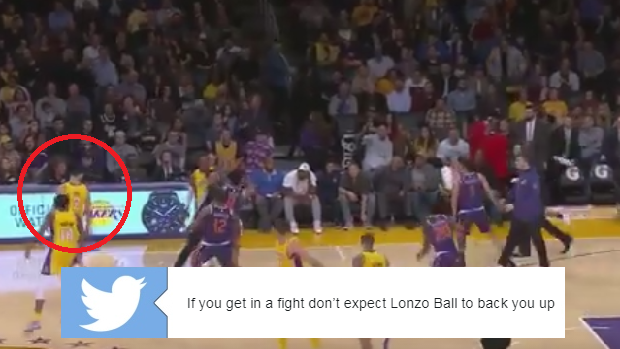 Lonzo Ball walks away from a mid-game scrum during the Lakers' home game against the Suns.