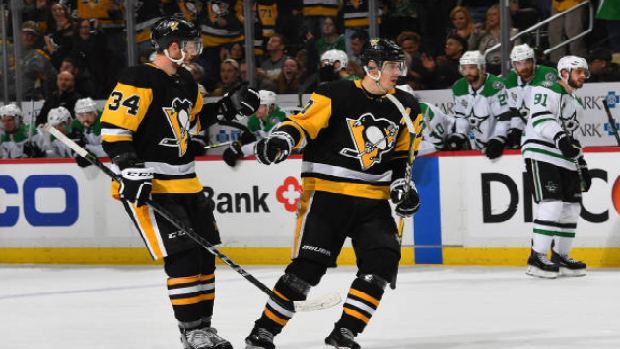 Pittsburgh Penguins forward Evgeni Malkin celebrates scoring a goal.