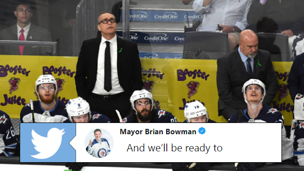 Head coach Paul Maurice and Winnipeg Jets players on the bench.