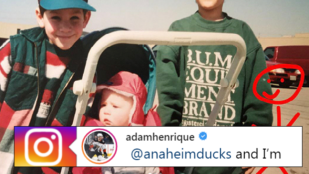 A young Adam Henrique poses in a photo with his brothers.