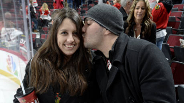 A couple takes in a Blackhawks vs. Red Wings game.