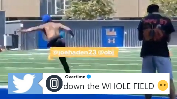 Odell Beckham Jr. tosses a football an entire practice field.