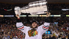 Jonathan Toews hoists the Stanley Cup back in 2013.