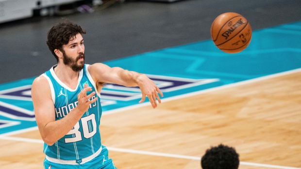 Charlotte Hornets guard Nate Darling (30) passes the ball against the Toronto Raptors