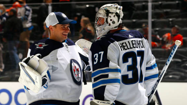 Connor Hellbuyck and Eric Comrie