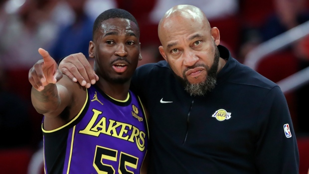 Los Angeles Lakers guard D'Moi Hodge talks with head coach Darvin Ham