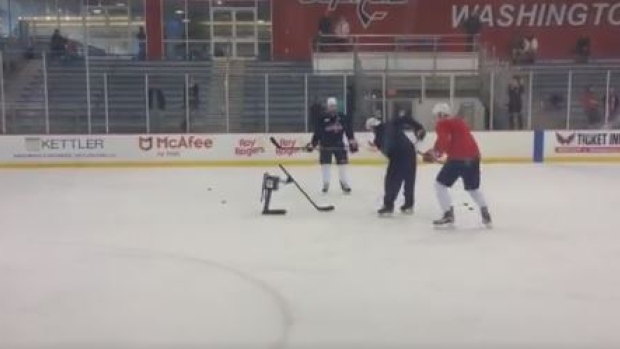 Washington Capitals players practiced with a robot to improve their stick-handling skills.