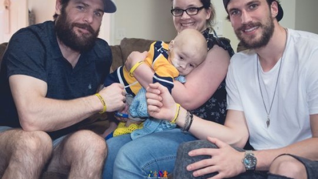 Roman Josi and Mike Fisher visit two-year-old fan battling cancer, Trip Phinney