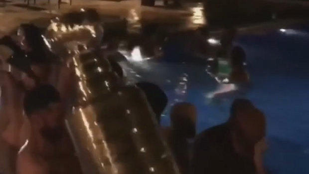 Penguins throw Stanley Cup into pool, Lemieux jumps in at