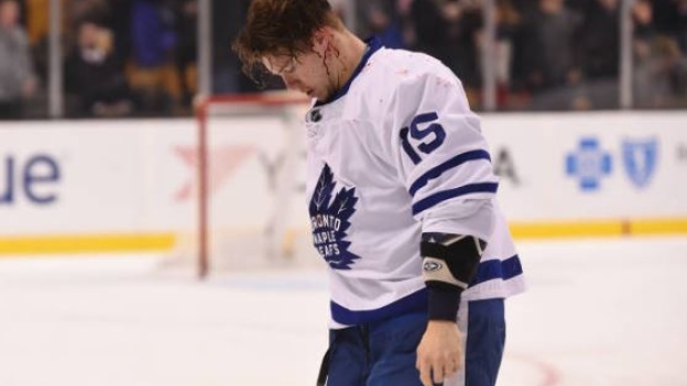 Matt Martin of the Toronto Maple Leafs leaves the ice after a fight against Adam McQuaid.