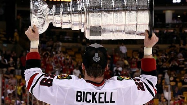 Bryan Bickell hoists the Stanley Cup after winning the 2013 Stanley Cup Final