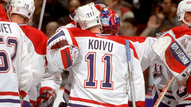 Saku Koivu celebrates after playing his first game back from cancer.
