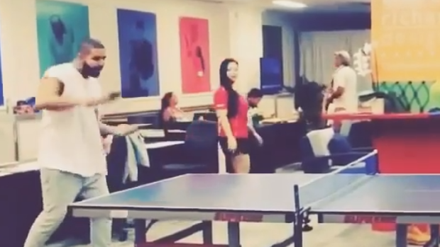 Drake engages in an intense ping pong rally.