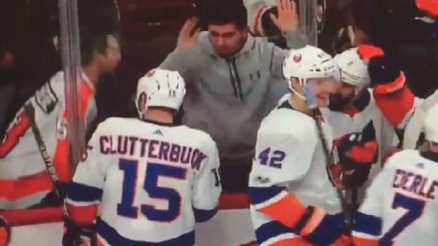 Cal Clutterbuck and a fans exchange words following the Islanders' 5-4 OT win over the Flyers.