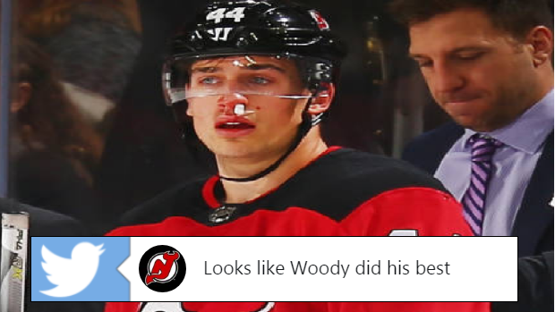 Miles Wood after getting clipped in the face with a high-stick.