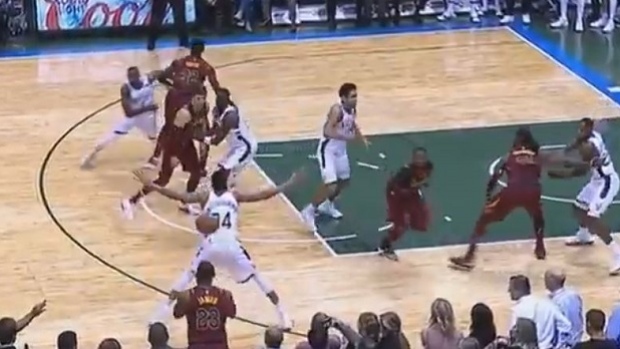 LeBron James bounces the ball in off Giannis Antetokounmpo's back
